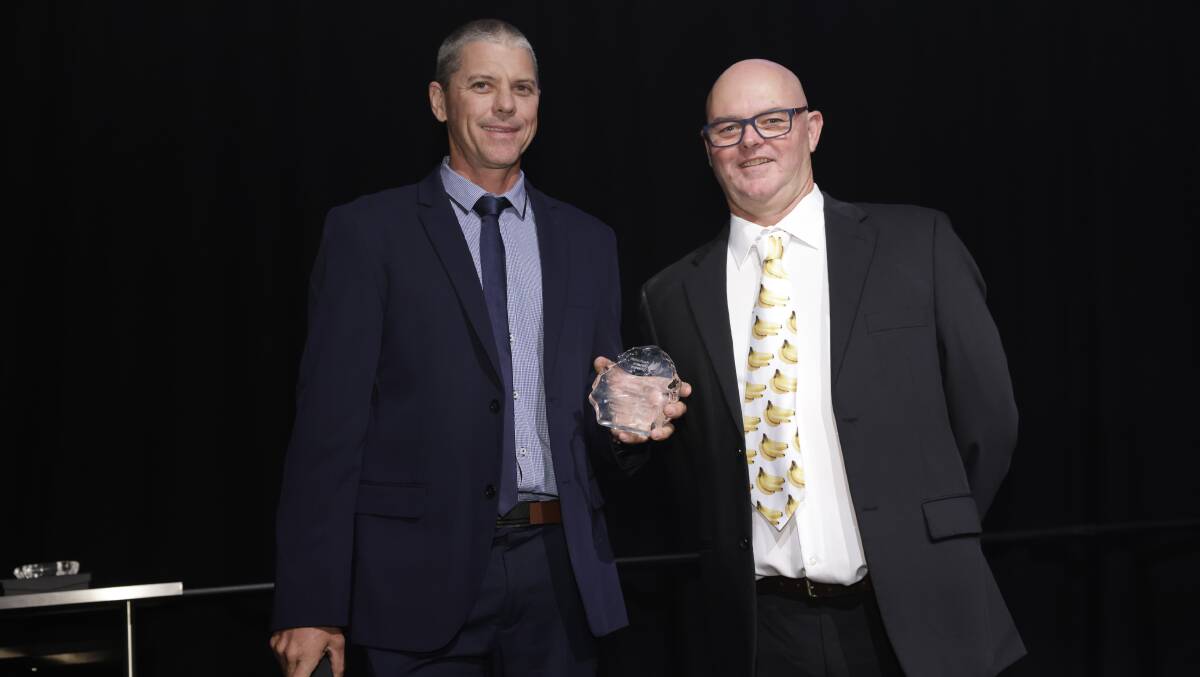 Former banana grower Paul Johnston was recognised at the industry's Awards of Honour, being presented by Australian Banana Growers' Council chair Leon Collins. Picture supplied