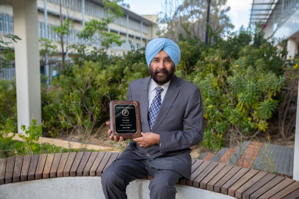 Edith Cowan University's professor Zora Singh with the plaque acknowledging his induction as a Fellow of the American Society for Horticultural Science (ASHS). Picture supplied 