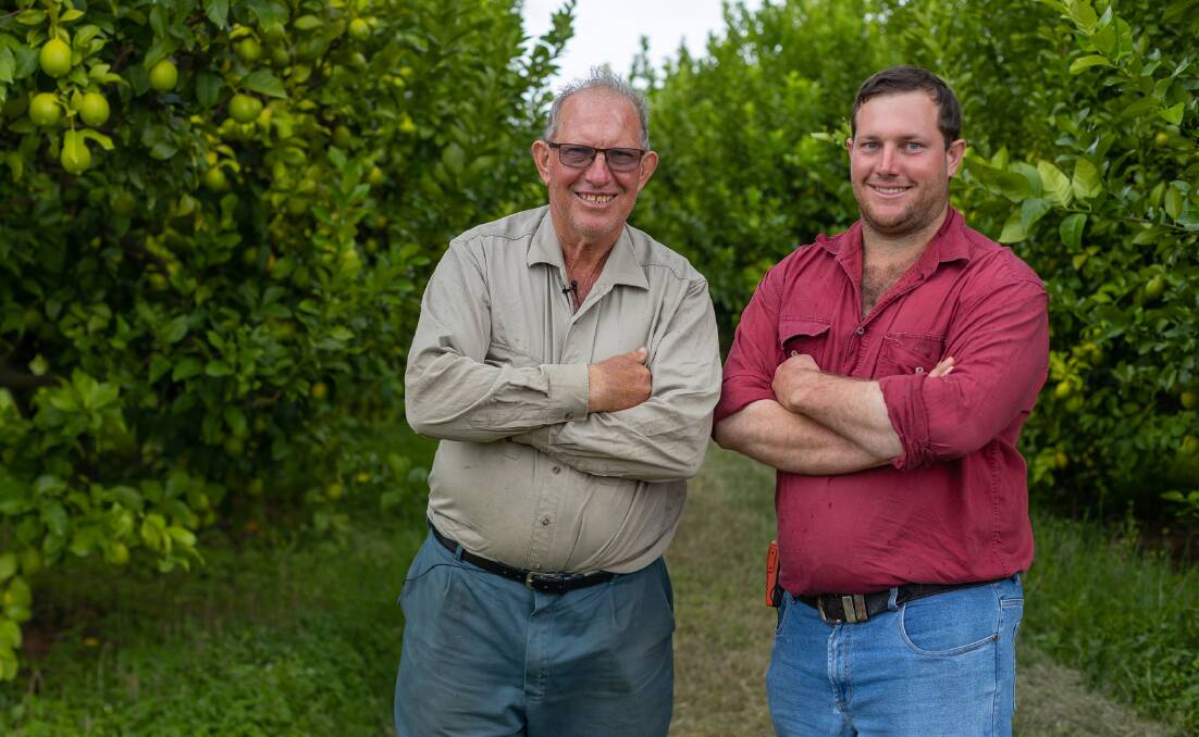 Oscar Bugno and son Dwaine on the family's extensive North Qld citrus property. Picture supplied