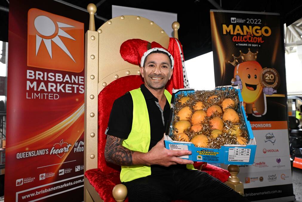 Sam Etri, Skippy's Fresh Frootz, Victoria Point, Qld with the $20,000 tray of mangoes purchased at the 2022 Brisbane Produce Market Mango Auction. Picture supplied