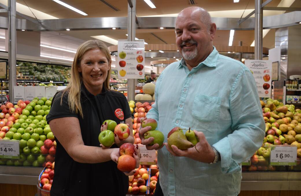 SA Produce Markets' Penny Reidy and Fruit Producers SA CEO Grant Piggott with some of the fresh apples and pears available in store. Picture by Elizabeth Anderson