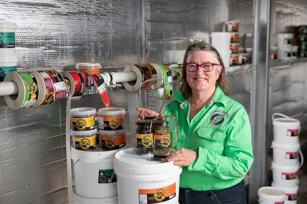 Parafield Olives' Margaret Carter with her winning Parafield Organic Table Olives Wallis variant and Parafield Organic Table Olives Dried Kalamata. Picture by Madeline Begley 