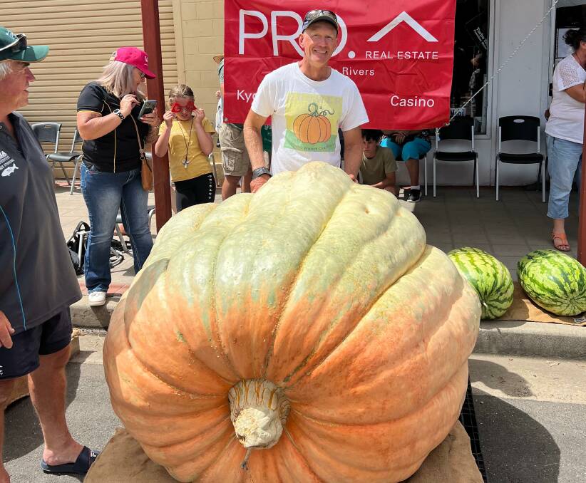 Tintenbar nurseryman Dale Oliver with his 674.5kg Giant Atlantic variety pumpkin at Kyogle on Saturday. Picture by Lillian Cox